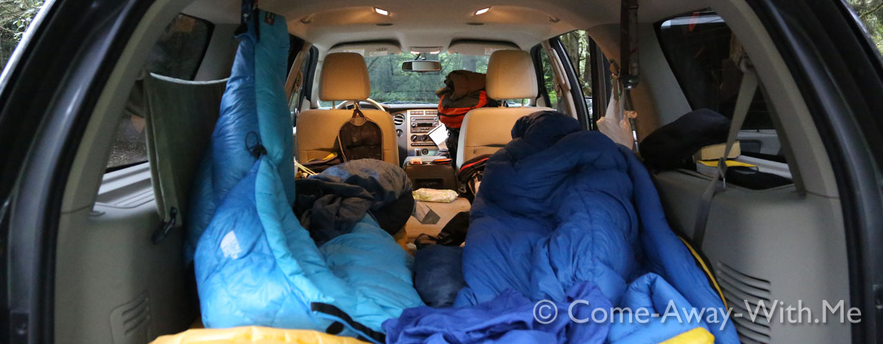 Inside our SUV car, with sleeping bags, and all our gear