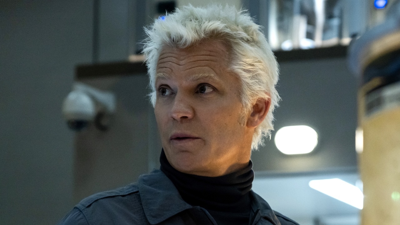 Timothy Olyphant looks to the side with concern in Alien: Earth. 
